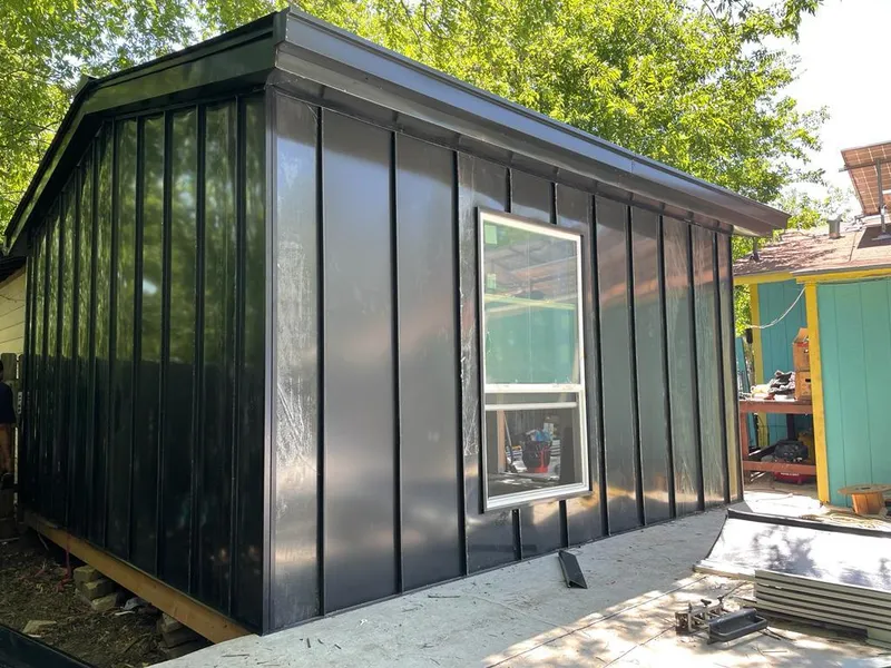 Black standing seam metal wall panels for Roof Inspection in Chatham